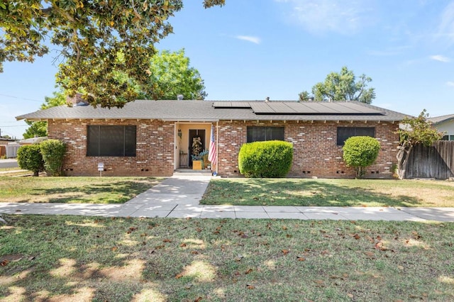 1646 W Cornell Ave, Fresno, CA 93705 - ranch-style home with roof mounted solar panels, brick siding, and crawl space