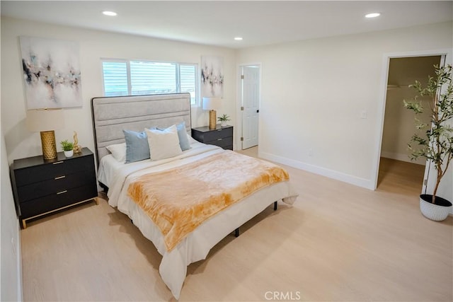 8213 Ethel Ave, North Hollywood, CA 91605 - bedroom with light wood-type flooring, recessed lighting, baseboards, and a walk in closet