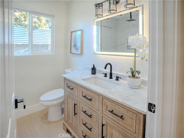 8213 Ethel Ave, North Hollywood, CA 91605 - bathroom featuring vanity, toilet, a shower, and baseboards