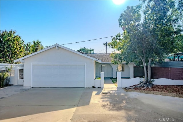 8213 Ethel Ave, North Hollywood, CA 91605 - ranch-style house featuring stucco siding, concrete driveway, and a garage