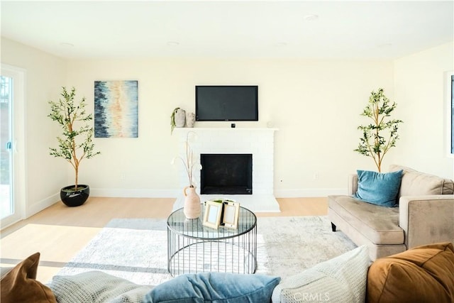 8213 Ethel Ave, North Hollywood, CA 91605 - living room featuring wood finished floors, baseboards, and a fireplace