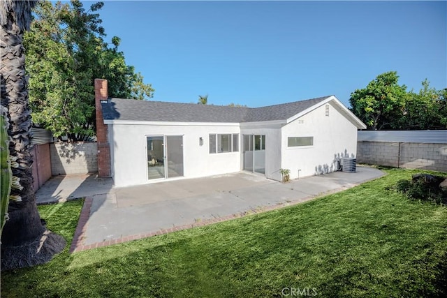 8213 Ethel Ave, North Hollywood, CA 91605 - rear view of house featuring stucco siding, central AC, a patio, and a chimney