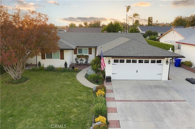 7680 Jadeite Ave, Rancho Cucamonga, CA 91730 - ranch-style house featuring an attached garage, driveway, a yard, a shingled roof, and stucco siding