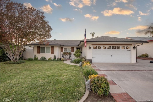 7680 Jadeite Ave, Rancho Cucamonga, CA 91730 - ranch-style house featuring driveway, a garage, a front yard, and stucco siding