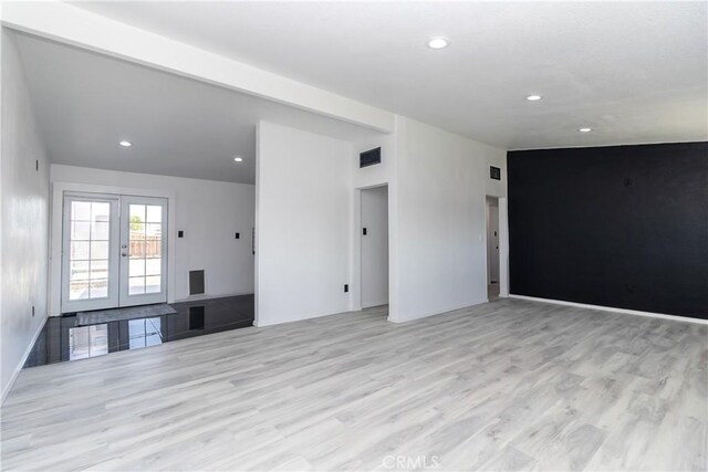 2025 Rio Vis, Needles, CA 92363 - unfurnished living room featuring light wood-type flooring, french doors, and recessed lighting