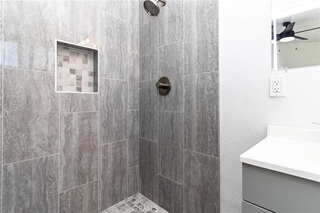 2025 Rio Vis, Needles, CA 92363 - bathroom with tiled shower, vanity, and ceiling fan