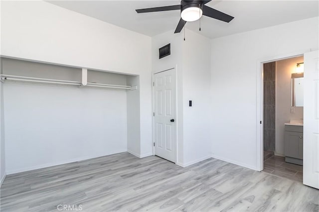 2025 Rio Vis, Needles, CA 92363 - unfurnished bedroom featuring light wood-type flooring, baseboards, a closet, ensuite bathroom, and ceiling fan