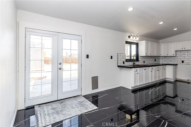 2025 Rio Vis, Needles, CA 92363 - kitchen featuring french doors, white cabinets, backsplash, recessed lighting, and baseboards