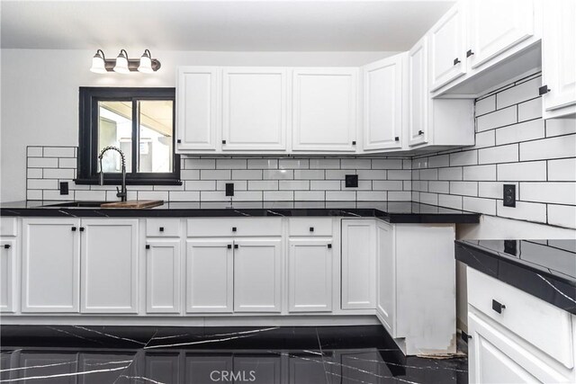 2025 Rio Vis, Needles, CA 92363 - kitchen with a sink, dark countertops, and white cabinetry