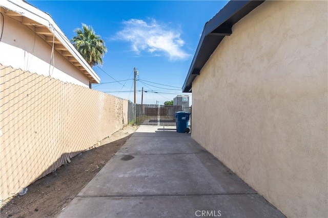 2025 Rio Vis, Needles, CA 92363 - view of side of property featuring stucco siding and a patio area