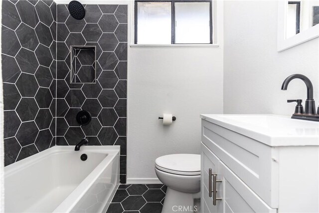 2025 Rio Vis, Needles, CA 92363 - bathroom with vanity, toilet, tile patterned flooring, baseboards, and washtub / shower combination