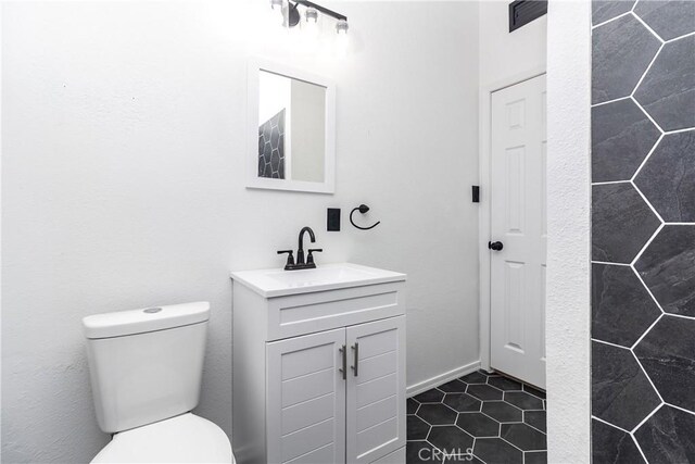 2025 Rio Vis, Needles, CA 92363 - half bath with vanity, toilet, and tile patterned flooring