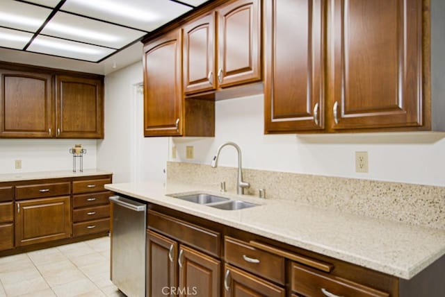 3375 Punta Alta Unit A, Laguna Woods, CA 92637 - kitchen featuring a sink, dishwasher, light tile patterned flooring, and light stone counters