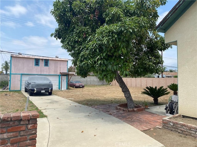 423 S Virginia Ave, Azusa, CA 91702 - view of yard with a detached garage and concrete driveway