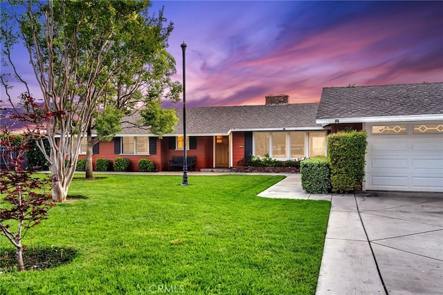2886 Mcallister St, Riverside, CA 92503 - ranch-style home with a front yard, a garage, driveway, and roof with shingles
