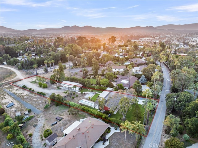 2886 Mcallister St, Riverside, CA 92503 - aerial view of property and surrounding area with a mountainous background, property parcel outlined, and nearby suburban area