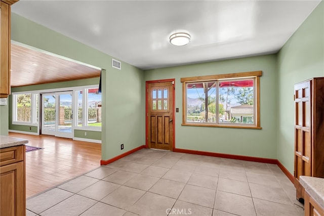2886 Mcallister St, Riverside, CA 92503 - entryway featuring plenty of natural light, baseboards, and light tile patterned floors