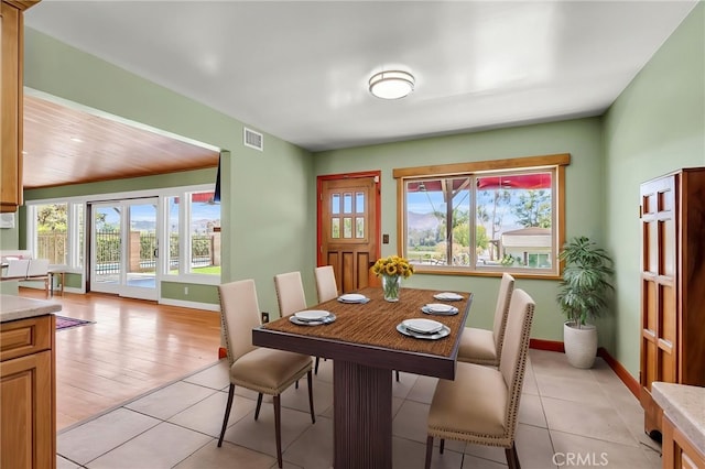 2886 Mcallister St, Riverside, CA 92503 - dining room with healthy amount of natural light, baseboards, and light tile patterned flooring