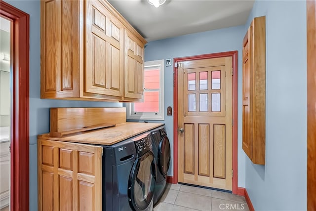 2886 Mcallister St, Riverside, CA 92503 - laundry room with cabinet space, washer and dryer, light tile patterned floors, and baseboards