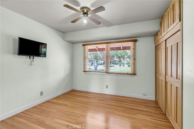 2886 Mcallister St, Riverside, CA 92503 - unfurnished bedroom with light wood-type flooring, baseboards, and ceiling fan