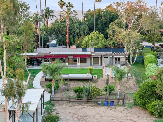 2886 Mcallister St, Riverside, CA 92503 - rear view of property featuring stucco siding and a chimney