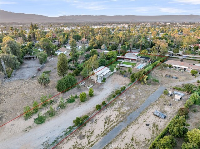 2886 Mcallister St, Riverside, CA 92503 - aerial view of property and surrounding area with property boundaries highlighted and mountains