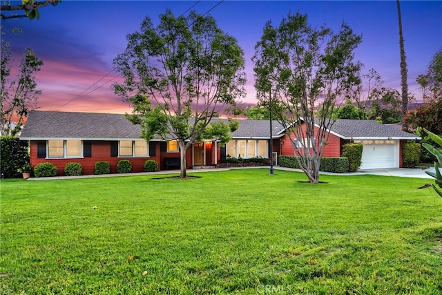 2886 Mcallister St, Riverside, CA 92503 - ranch-style home featuring a garage, a front lawn, driveway, and a shingled roof