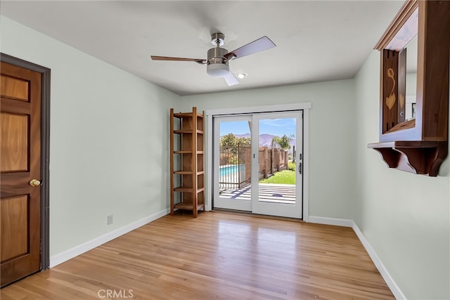 2886 Mcallister St, Riverside, CA 92503 - empty room with light wood-style flooring, baseboards, and a ceiling fan
