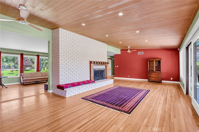 2886 Mcallister St, Riverside, CA 92503 - unfurnished living room featuring ceiling fan, wood ceiling, a fireplace, light wood finished floors, and baseboards