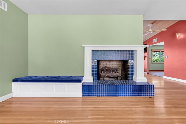 2886 Mcallister St, Riverside, CA 92503 - detailed view of wood finished floors, baseboards, a fireplace, and ceiling fan