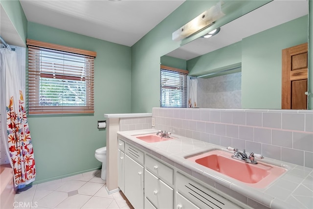 2886 Mcallister St, Riverside, CA 92503 - bathroom with plenty of natural light, backsplash, double vanity, and toilet