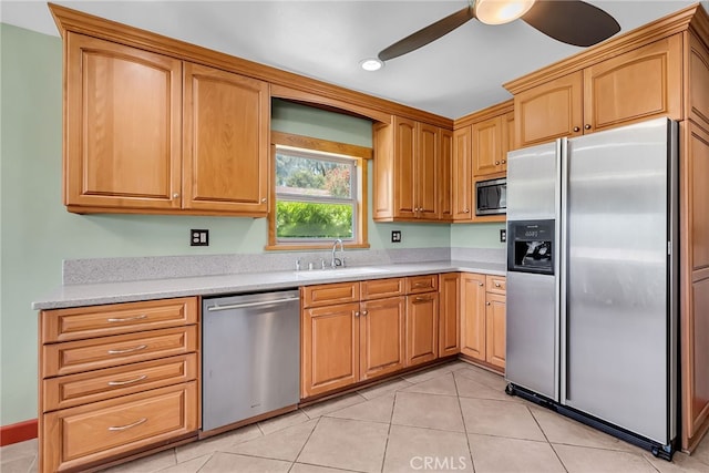 2886 Mcallister St, Riverside, CA 92503 - kitchen featuring stainless steel appliances, a sink, light countertops, ceiling fan, and light tile patterned flooring