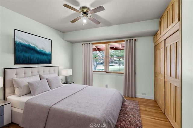 2886 Mcallister St, Riverside, CA 92503 - bedroom with light wood-style floors, baseboards, and a ceiling fan