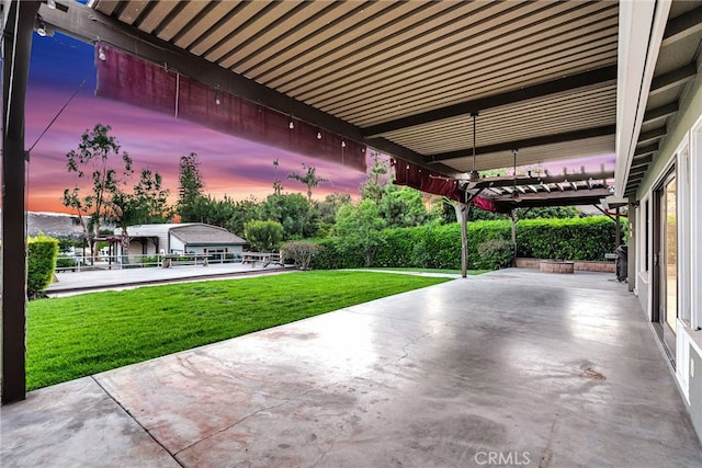 2886 Mcallister St, Riverside, CA 92503 - patio terrace at dusk featuring a yard and a patio