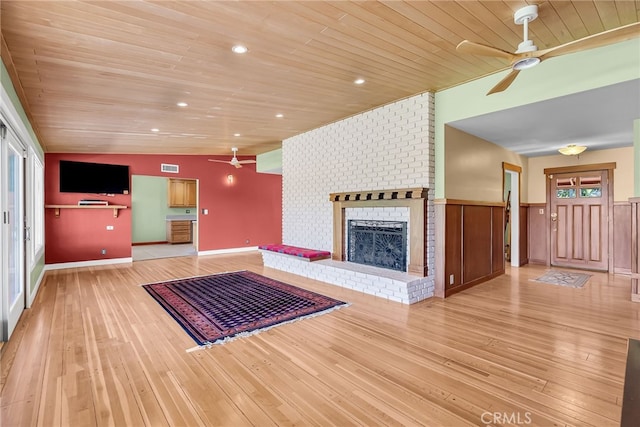 2886 Mcallister St, Riverside, CA 92503 - unfurnished living room featuring ceiling fan, wooden ceiling, a fireplace, and light wood-style flooring