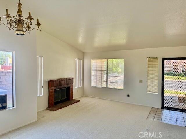 2125 Bramble Ln, Palmdale, CA 93550 - unfurnished living room with a chandelier, carpet, a brick fireplace, lofted ceiling, and baseboards