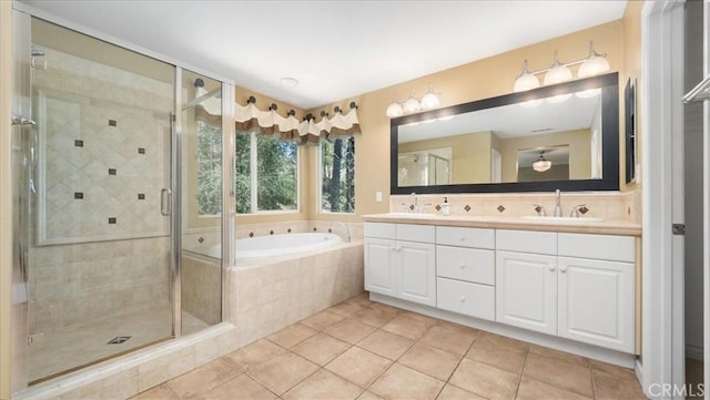 25030 Crimson Lasso Dr, Wildomar, CA 92595 - bathroom featuring a garden tub, double vanity, a shower stall, and tile patterned floors