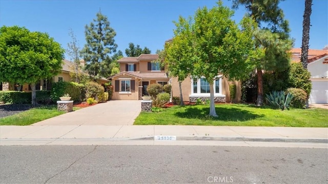 25030 Crimson Lasso Dr, Wildomar, CA 92595 - obstructed view of property featuring driveway, stucco siding, and a front yard