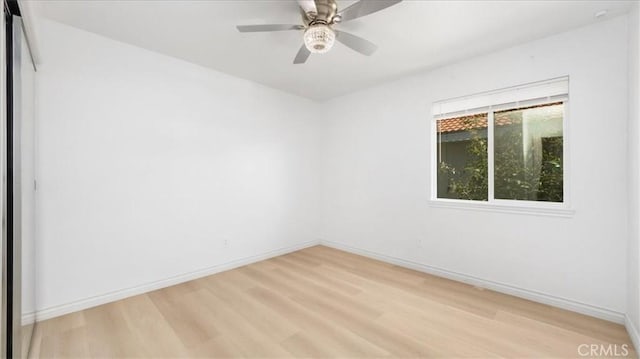25030 Crimson Lasso Dr, Wildomar, CA 92595 - empty room featuring light wood-style flooring, baseboards, and ceiling fan