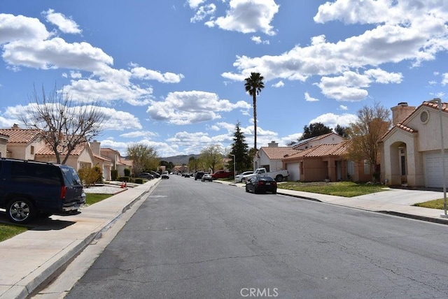37733 Harvey St, Palmdale, CA 93550 - view of asphalt road with a residential view, sidewalks, and curbs