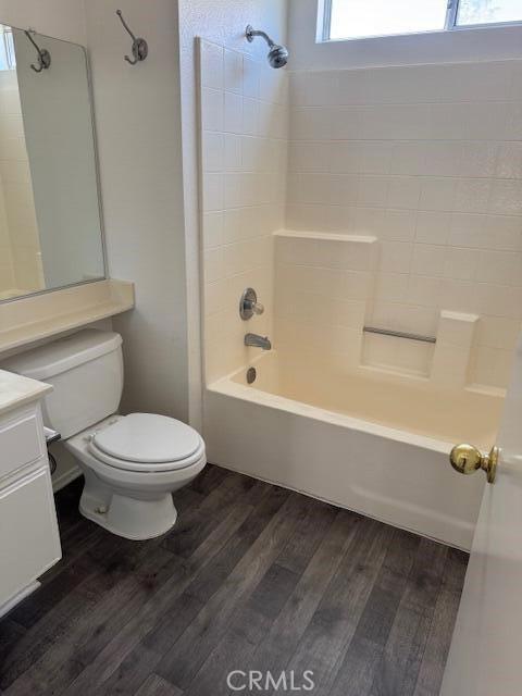 37733 Harvey St, Palmdale, CA 93550 - full bath with vanity, shower / bath combination, wood finished floors, and toilet
