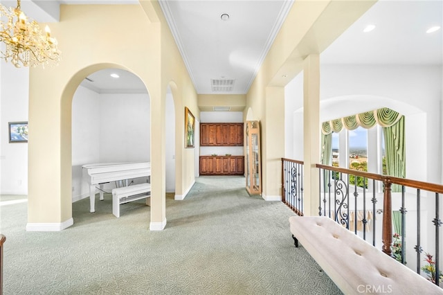 37626 Via Majorca, Murrieta, CA 92562 - hallway featuring carpet flooring, a chandelier, arched walkways, crown molding, and baseboards