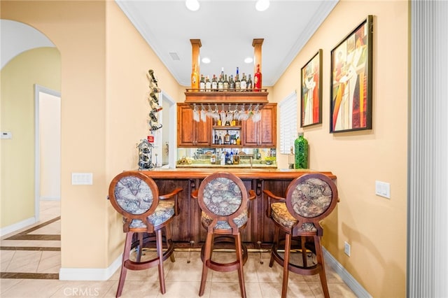 37626 Via Majorca, Murrieta, CA 92562 - indoor wet bar with arched walkways, tile patterned flooring, recessed lighting, and baseboards