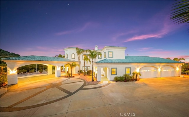 37626 Via Majorca, Murrieta, CA 92562 - mediterranean / spanish home with curved driveway, a garage, and stucco siding