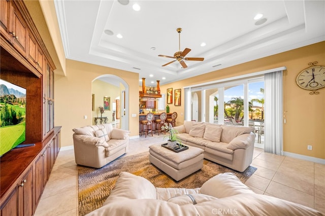 37626 Via Majorca, Murrieta, CA 92562 - living room featuring a raised ceiling, arched walkways, light tile patterned floors, a ceiling fan, and baseboards