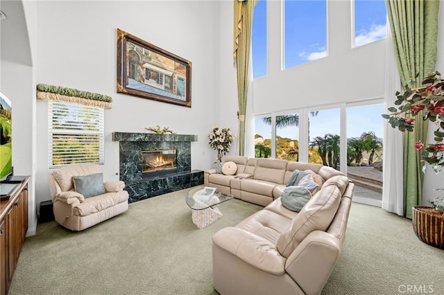 37626 Via Majorca, Murrieta, CA 92562 - carpeted living area featuring a towering ceiling, a fireplace, and healthy amount of natural light