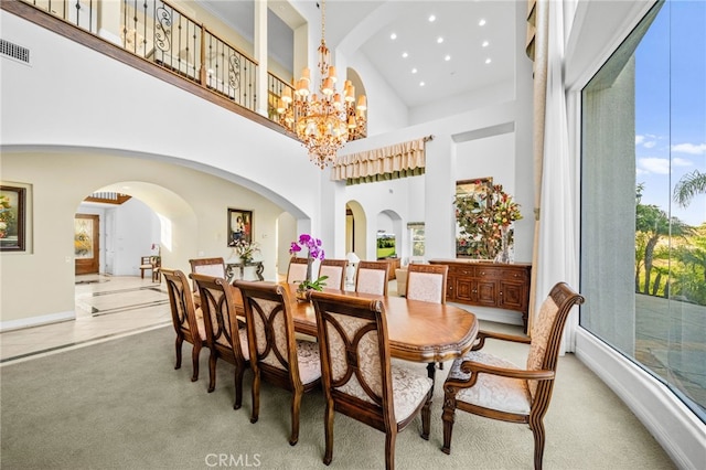 37626 Via Majorca, Murrieta, CA 92562 - dining room with a high ceiling, light colored carpet, a chandelier, recessed lighting, and arched walkways