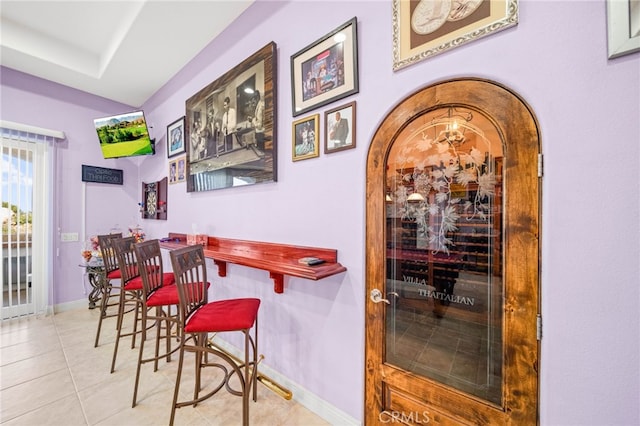 37626 Via Majorca, Murrieta, CA 92562 - bar area featuring arched walkways, tile patterned floors, and baseboards