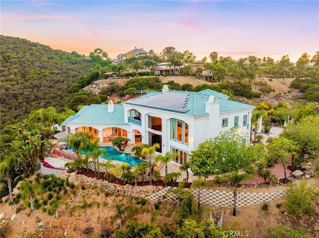 37626 Via Majorca, Murrieta, CA 92562 - view of front of home with an outdoor pool, a patio, and stucco siding