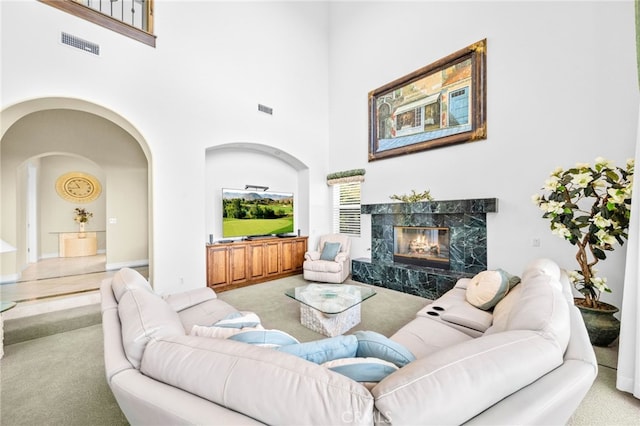 37626 Via Majorca, Murrieta, CA 92562 - carpeted living area featuring a high ceiling, a fireplace, and arched walkways